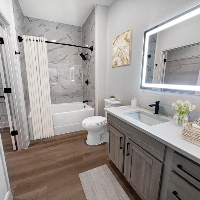 Instrata Upper Kirby - Modern bathroom with double sinks and tub